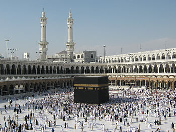 Thousands of pilgrims surround the Kaaba in Mecca, showcasing Islamic unity and devotion. HD wallpaper