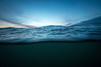 Capture of calm ocean waves during sunset in La Pampa, Argentina. Tranquil seascape with vivid sky. HD wallpaper