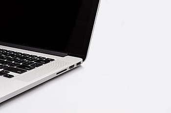 Closeup of a sleek laptop keyboard and screen on a white background. Perfect for tech-related content. HD wallpaper