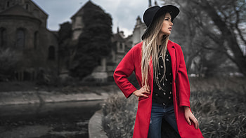 Beautiful Girl Model Is Standing In Blur Buildings Background Wearing Black Top Blue Jeans And Red Overcoat Girls HD wallpaper