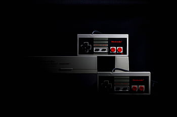 Retro gaming controllers from the Nintendo Entertainment System in low-key lighting, evoking nostalgia. HD wallpaper