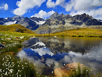 Mountainscape, river, spring, mountain, lake, summer, reflection, clouds, nature, flowers, sky, water HD wallpaper
