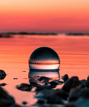 Crystal ball, sunset, reflections HD phone wallpaper
