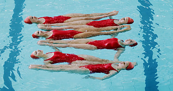 Female synchronizers, Pool immersion, Synchronized beauty, Captivating stock video HD wallpaper