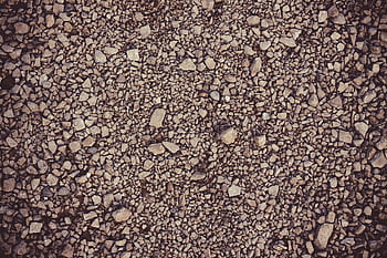 Detailed gravel surface texture, perfect for backgrounds in design projects. HD wallpaper