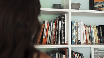 Person getting a book from a shelf, Library visit, Book browsing, Reading materials HD wallpaper