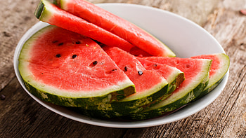 Watermelon on a plate, Freshly cut slices, Red and juicy goodness, Perfect for TV snacking HD wallpaper
