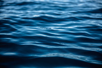 Close-up view of tranquil ocean waves with blue hues illustrating serenity and nature's beauty. HD wallpaper