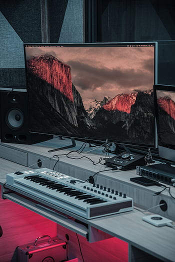 Discover a cutting-edge music studio featuring electronic equipment and an audio mixer. HD phone wallpaper