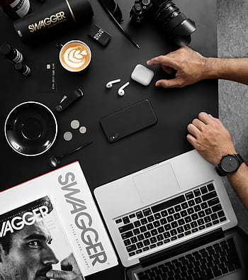 A contemporary workspace featuring tech devices, coffee, and a stylish magazine. HD phone wallpaper