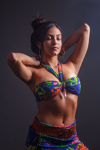 Portrait of a woman posing gracefully in a floral bikini indoors. HD phone wallpaper