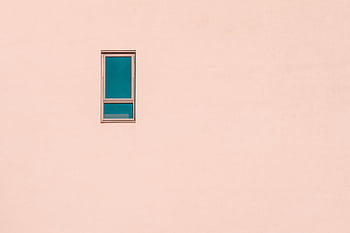 A minimalist pastel pink wall featuring a single rectangular window, offering ample negative space. HD wallpaper