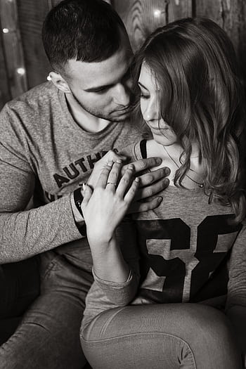 Close-up of a couple sharing a tender moment, showcasing intimacy and love. HD phone wallpaper
