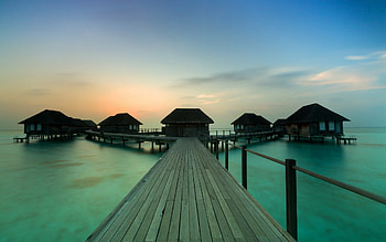 Paradise, sea, pier, houses, sunrise, clouds, nature, sky, splendor, ocean HD wallpaper