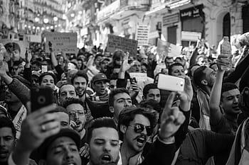 Crowded Algerian street protest captured with intensity and detail. HD wallpaper