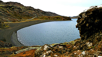 Part of Kleifarvatn Lake in Iceland, with black sand beaches, landscape, rocks, water, stones, sky HD wallpaper