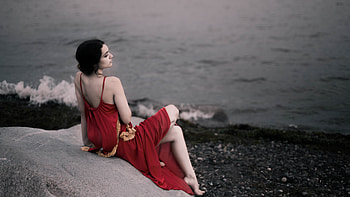 Girl In Red Dress Sitting On Rocks Beach , girls, model, red-dress, graphy HD wallpaper