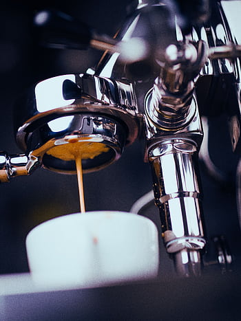 A shiny espresso machine brews coffee with an espresso shot pouring into a white cup. HD phone wallpaper