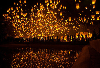 Thousands of lanterns take to the night sky in a lantern festival in Thailand. HD wallpaper