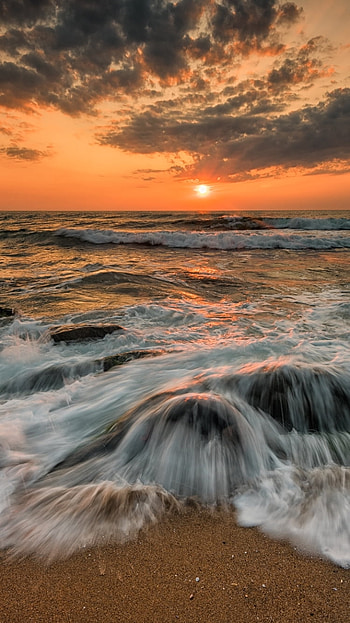 Waves over Ocean Rocks at Sunset, wave, ocean, sun, nature, Ocean Waves HD phone wallpaper
