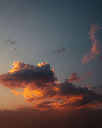 Stunning sunset sky with dramatic orange and red clouds creating a serene atmosphere. HD phone wallpaper