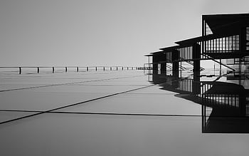 A striking minimalist black and white featuring architectural reflections on glass surfaces. HD wallpaper