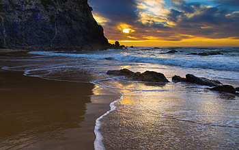 Tropical Sunset, colorful, sand, colors, peaceful, beauty, beach, waves, reflection, ocean, sunset, sea, paradise, beautiful, rocks, stones, summer, view, clouds, nature, sky, lovely, splendor HD wallpaper