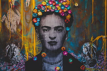 Colorful mural depicting a famous Mexican figure with floral designs, showcasing vibrant street art culture. HD wallpaper