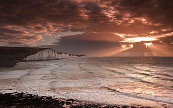 glorious sunbeams over seacoast, sea, waves, cliffs, beams, coast, clouds, sun HD wallpaper