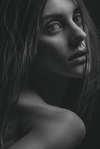 Artistic black and white portrait showcasing the beauty and elegance of a young woman in a studio setting. HD phone wallpaper