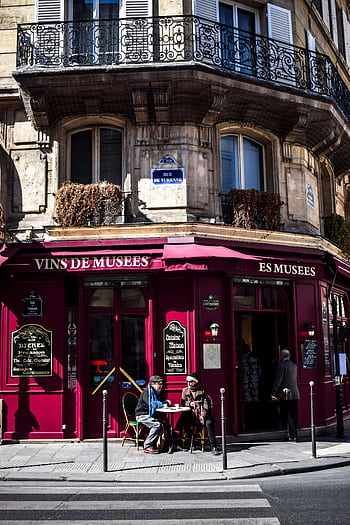 A classic Parisian café in the vibrant city setting, perfect for urban exploration. HD phone wallpaper