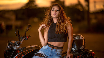Stunning Beauty Girl Model Is Sitting On Bike Wearing Black Top And Blue Jeans In Dark Background Girls HD wallpaper