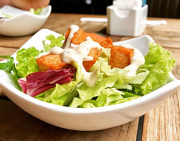 Delicious salad with crispy tofu and creamy dressing, perfect for a healthy meal. HD wallpaper