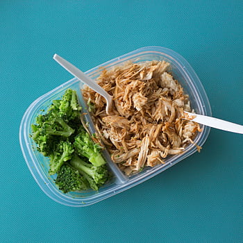 Delicious packed lunch with shredded chicken, rice, and broccoli in a tupperware container. HD phone wallpaper