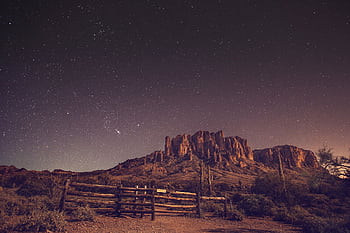 A breathtaking night sky above the Superstition Mountains with a starry desert landscape. HD wallpaper