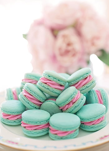 A stack of blue macarons with pink filling on a decorative plate, perfect for food graphy. HD phone wallpaper