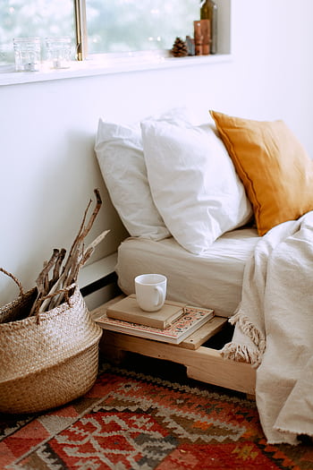 A serene bedroom scene showcasing cozy textiles, warm hues, and inviting comfort. HD phone wallpaper