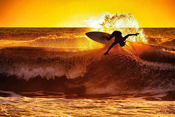Sunset beach surfing, Golden hour magic, Ocean tranquility, Surfer's paradise HD wallpaper