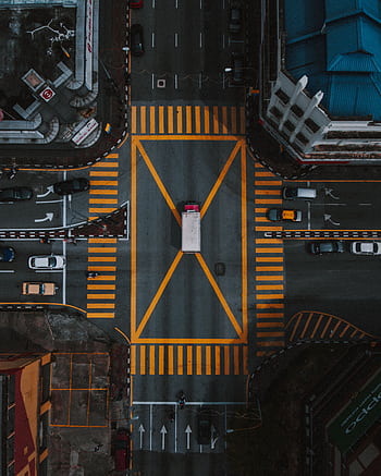 High-angle aerial view of a busy intersection in Ipoh, Malaysia, showcasing urban road layout. HD phone wallpaper
