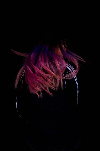 Dynamic of person with pink and purple hair in motion against dark background. HD phone wallpaper