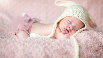 Cute Baby Child Is Sleeping On Fur Woolen Cloth Wearing Light Peach Color Dress And Woolen Knitted Cap Cute HD wallpaper