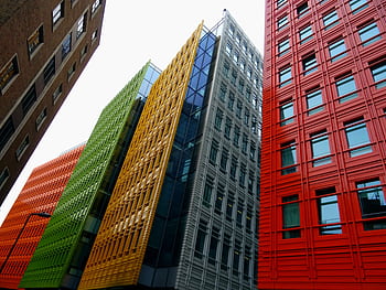 Vibrant colored skyscrapers in a modern cityscape showcasing innovative architecture and design. HD wallpaper