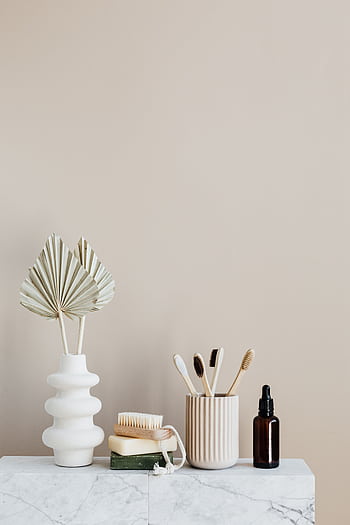 Elegant eco-friendly bathroom setup with natural décor on a marble surface. HD phone wallpaper