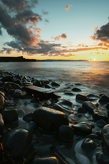 Coast, black rocks, sunset HD phone wallpaper