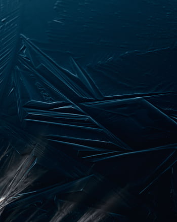 Close-up of abstract ice textures on a dark blue frozen lake surface. HD phone wallpaper