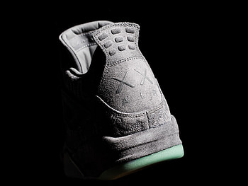 The Air Jordan 4 Retro “KAWS” is the first ever collaborative project between the Jordan Brand and KAWS that takes the retro sneaker design past a simple ... HD wallpaper