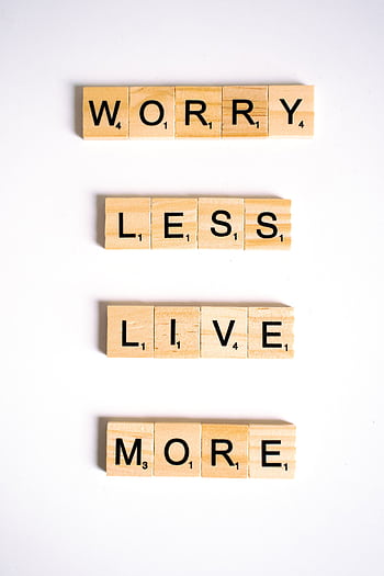 Motivational quote made from Scrabble tiles on a white background, inspiring positivity. HD phone wallpaper