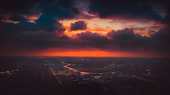 A stunning aerial view of Shanghai cityscape beneath a vibrant sunset sky. HD wallpaper