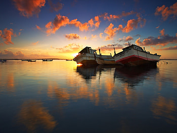 Boats at Sunset, mirror, sunrise, lake, reflection, boats, clouds, nature, sky, sunset HD wallpaper