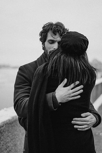 A couple shares an intimate embrace in a black and white , conveying love and togetherness. HD phone wallpaper